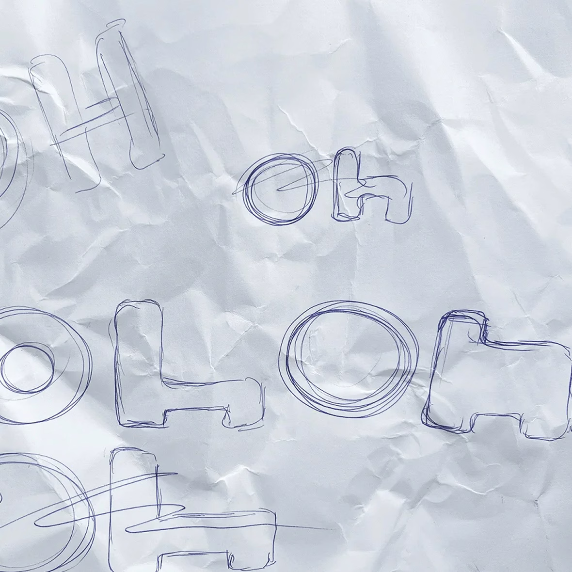Early logo sketches on paper