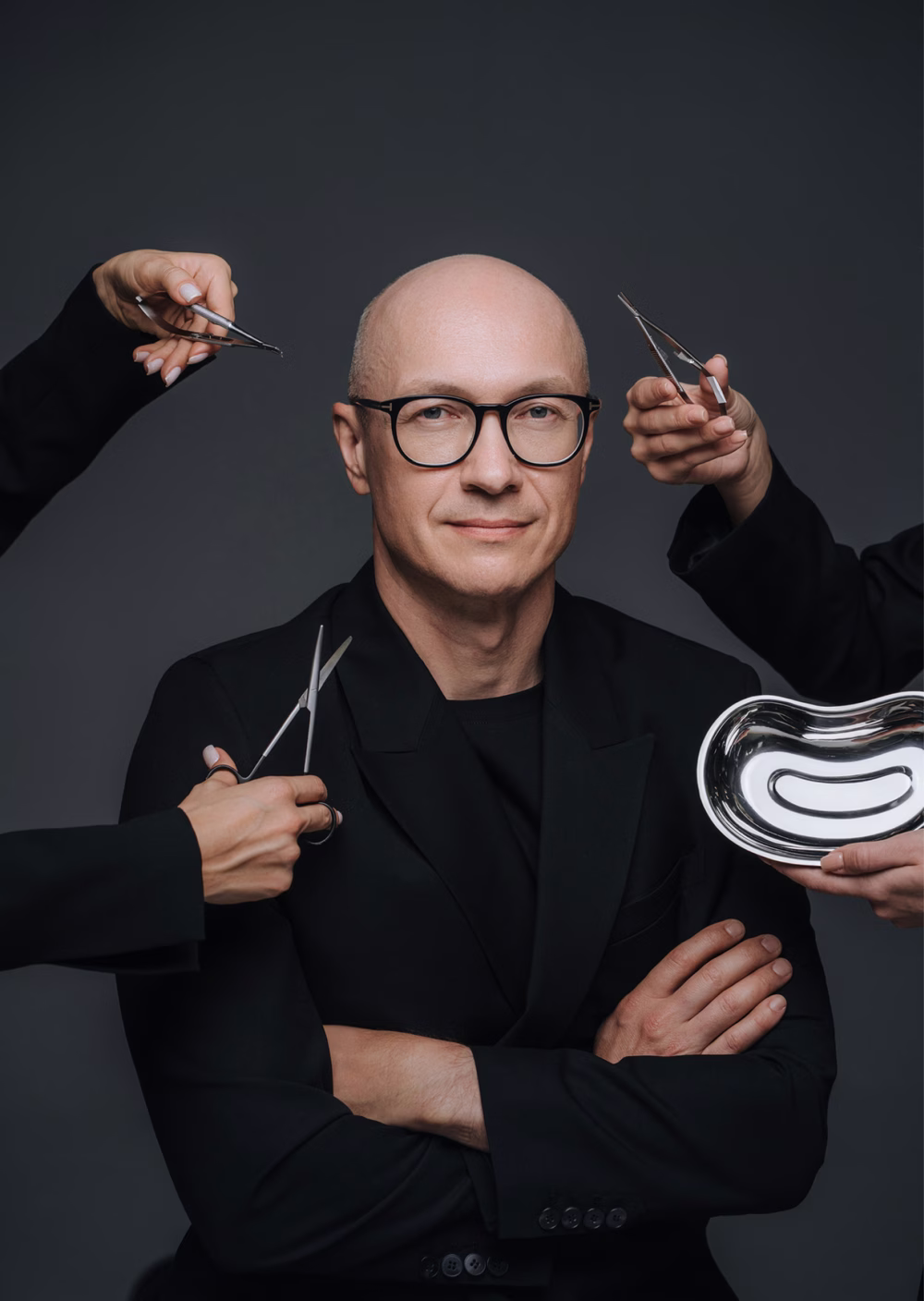 The surgeon with surgical scissors held around him